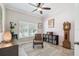 Inviting office with a comfortable chair, natural light, and stylish decor at 18796 Obregan Dr, Spring Hill, FL 34610