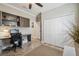 Well-lit home office with built-in shelving and convenient closet access at 18796 Obregan Dr, Spring Hill, FL 34610