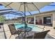 Inviting backyard featuring a sparkling pool, outdoor seating, and a covered patio at 18796 Obregan Dr, Spring Hill, FL 34610