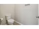 Neutral powder room featuring a toilet and tile floor at 18796 Obregan Dr, Spring Hill, FL 34610
