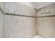 Walk-in shower featuring tile surround and decorative accent at 18796 Obregan Dr, Spring Hill, FL 34610