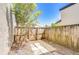 Enclosed backyard featuring wood fence and mature tree at 1881 N Hercules Ave # 1303, Clearwater, FL 33765