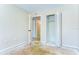 Bedroom featuring an open closet, natural light, and easy access to other rooms at 1881 N Hercules Ave # 1303, Clearwater, FL 33765