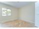 A sunlit bedroom featuring a window and closet at 1881 N Hercules Ave # 1303, Clearwater, FL 33765