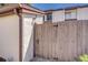 Close-up view of a charming wooden gate entrance to the property with unit number at 1881 N Hercules Ave # 1303, Clearwater, FL 33765
