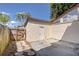 Home exterior featuring a private patio, white door and stone walkway at 1881 N Hercules Ave # 1303, Clearwater, FL 33765