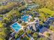 Overhead shot of a community pool, tennis courts, a playground, and clubhouse at 20121 Bending Creek Pl, Tampa, FL 33647