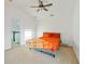 Sunny bedroom offers plush carpeting, ceiling fan and a comfortable space at 20121 Bending Creek Pl, Tampa, FL 33647