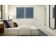 Bright bedroom with a comfortable bed and modern decor for a relaxing retreat at 2292 Blue Grosbeak Pl, Wimauma, FL 33598