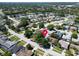 An aerial view shows the property and surrounding neighborhood with mature trees and well-maintained lawns at 2366 Covington Dr, Clearwater, FL 33763