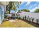 Backyard with a chicken coop, privacy fence, and mature trees at 2366 Covington Dr, Clearwater, FL 33763