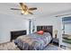Bedroom features wood floors, ceiling fan, and neutral paint at 2366 Covington Dr, Clearwater, FL 33763