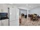 Open concept kitchen with white cabinets and stainless steel appliances at 2366 Covington Dr, Clearwater, FL 33763