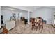 Open concept living room with dining area showcases lots of natural light and neutral decor at 2366 Covington Dr, Clearwater, FL 33763