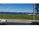Picturesque waterfront views featuring sailboats, lush green lawns, and clear blue skies at 267 Colonial Blvd # 9, Palm Harbor, FL 34684