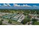 Panoramic aerial view of a tennis club, buildings, parking lot and golf course at 2700 Westchester N Dr, Clearwater, FL 33761