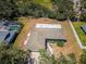 Aerial view of a residential property with an adjacent pool and well-defined property lines at 2700 Westchester N Dr, Clearwater, FL 33761