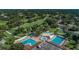Beautiful aerial view of a clubhouse with swimming pools near a well-maintained golf course at 2700 Westchester N Dr, Clearwater, FL 33761