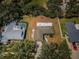 Aerial view of a residential property with an adjacent pool and well-defined property lines at 2700 Westchester N Dr, Clearwater, FL 33761