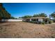 A home with a screen lanai, mature plants, and a privacy fence perfect for outdoor living at 2700 Westchester N Dr, Clearwater, FL 33761