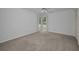 Bedroom with neutral carpet, ceiling fan, corner windows for natural light, and closet at 2700 Westchester N Dr, Clearwater, FL 33761