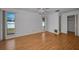Bright bedroom with wood flooring, a ceiling fan, and natural light from the windows at 2700 Westchester N Dr, Clearwater, FL 33761