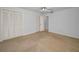 Bedroom with carpet, ceiling fan and ample closet space for all your storage needs at 2700 Westchester N Dr, Clearwater, FL 33761