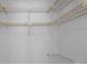 Walk-in closet featuring custom wire shelving and ample storage space at 2700 Westchester N Dr, Clearwater, FL 33761