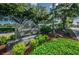 Attractive 'Countryside Country Club' sign, surrounded by lush greenery, inviting visitors to this established community at 2700 Westchester N Dr, Clearwater, FL 33761