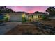 Well-maintained single-story home with an attached garage, complemented by lush landscaping and a welcoming walkway at 2700 Westchester N Dr, Clearwater, FL 33761