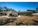 Charming single-story home featuring a well-manicured lawn, inviting curb appeal and an attached garage at 2700 Westchester N Dr, Clearwater, FL 33761