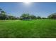 Scenic golf course view showcasing lush green lawns, mature trees, and a meticulously maintained landscape at 2700 Westchester N Dr, Clearwater, FL 33761