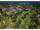 Aerial view of a golf course, highlighting the beautifully manicured fairways and surrounding community at 2700 Westchester N Dr, Clearwater, FL 33761