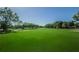 View of a pristine golf course featuring green fairways, sand traps, and mature trees at 2700 Westchester N Dr, Clearwater, FL 33761