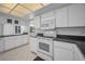 Bright kitchen with white appliances, lots of counter space, and natural light at 2700 Westchester N Dr, Clearwater, FL 33761