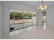Bright living room with tiled floors and sliding glass doors to outdoor patio at 2700 Westchester N Dr, Clearwater, FL 33761