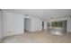 Open living area with a view of the lanai and adjacent room at 2700 Westchester N Dr, Clearwater, FL 33761