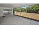 The screened porch leads to the backyard, with large windows providing ample natural light and a peaceful outdoor view at 2700 Westchester N Dr, Clearwater, FL 33761