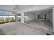 The screened porch provides seamless indoor-outdoor living with easy access to interior spaces and views of the lush landscaping at 2700 Westchester N Dr, Clearwater, FL 33761