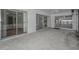 Spacious screened porch with sliding glass doors provide easy access to indoor living spaces at 2700 Westchester N Dr, Clearwater, FL 33761