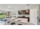 Modern kitchen featuring an island with seating, stainless steel appliances, and dark wood cabinets at 3332 Ivy Hollow Dr, Plant City, FL 33565