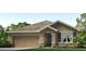 Charming single-story home with a two-car garage, landscaped yard, and neutral color palette at 3335 Ivy Hollow Dr, Plant City, FL 33565