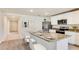 Bright kitchen features stainless appliances, granite countertops, and breakfast bar with seating at 3335 Ivy Hollow Dr, Plant City, FL 33565