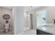 Bathroom featuring a toilet, shower, vanity with granite countertop, and a large mirror at 3338 Ivy Hollow Dr, Plant City, FL 33565