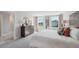 Spacious main bedroom with a plush bed, elegant furnishings, and large windows offering ample natural light at 3338 Ivy Hollow Dr, Plant City, FL 33565