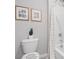 Cozy bathroom design featuring a stylish shower curtain and unique wall art at 3516 Rosewood Ramble Ct, Plant City, FL 33565