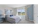 Stylish bedroom with a cozy bed, coordinated decor, and a bright window view at 3516 Rosewood Ramble Ct, Plant City, FL 33565