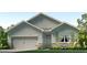Charming single-Gathering home featuring a two-car garage, stone accents, and well-manicured lawn at 3525 Thistle Bank Ct, Plant City, FL 33565