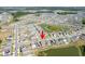 An aerial view showing homes surrounding the lake and ponds in a well-planned community at 35853 Buttonweed Trl, Zephyrhills, FL 33541