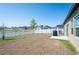 Expansive backyard with a view of the serene lake, perfect for outdoor activities at 35853 Buttonweed Trl, Zephyrhills, FL 33541